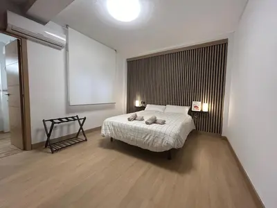 Cama o camas de una habitación en Apartamento Entre dos Puentes