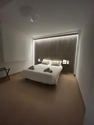 Cama o camas de una habitación en Apartamento Entre dos Puentes