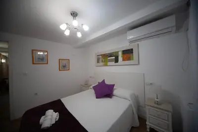Cama o camas de una habitación en Santa Catalina Center Apartment
