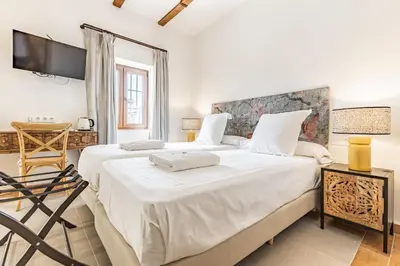 Cama o camas de una habitación en Hospedium Hotel Rural Virgen María