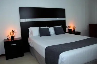 Cama o camas de una habitación en Hospedium Hotel Sky Blu Torre de Sevilla