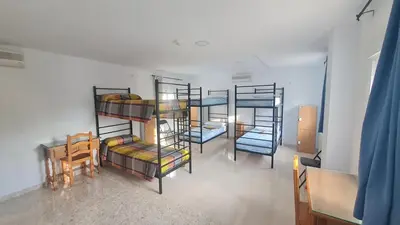 Cama o camas de una habitación en ALBERGUE LA TIÑOSA