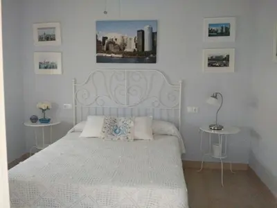 Cama o camas de una habitación en Casa de diseño con jardín cerca de Córdoba