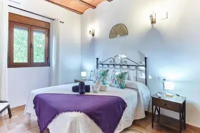 Cama o camas de una habitación en Alojamiento turístico Loma Alta