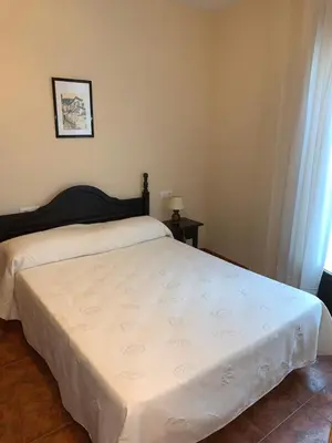 Cama o camas de una habitación en El Torreón