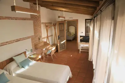 Cama o camas de una habitación en casa rural Cieza de León
