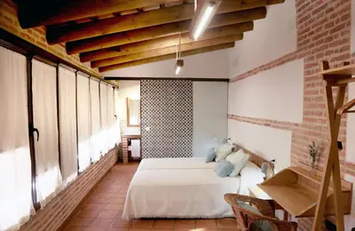 Cama o camas de una habitación en casa rural Cieza de León