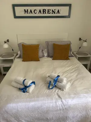 Cama o camas de una habitación en Arco MacarenA