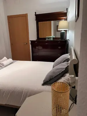 Cama o camas de una habitación en Apartamento con encanto muy céntrico en Pilatos Sevilla ideal para pareja