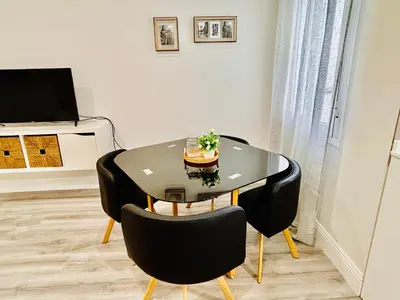 Una televisión o centro de entretenimiento en Gran Capitán Home