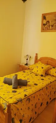 Cama o camas de una habitación en HOGAREÑO ADOSADO EN EL PUEBLO DE ARDALES