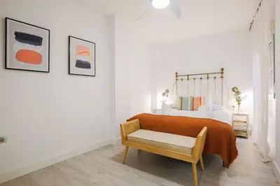 Cama o camas de una habitación en Santiago Suite Home