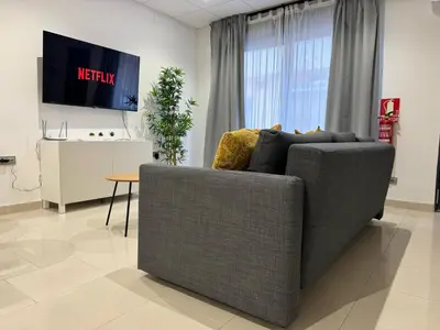 Una televisión o centro de entretenimiento en Apartamento Estación Mozárabes