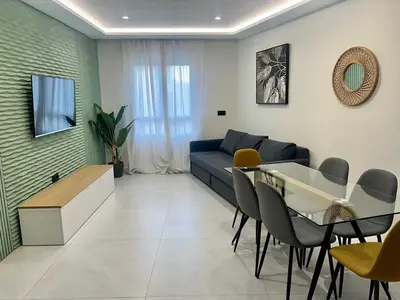Una televisión o centro de entretenimiento en Apartamento El Cardenal