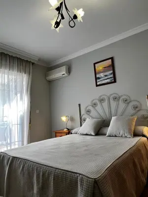 Cama o camas de una habitación en Hotel Arco del Sol
