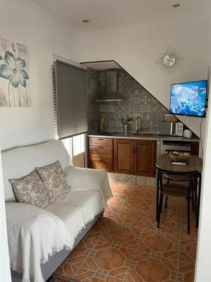 Una televisión o centro de entretenimiento en Casa de la Miel