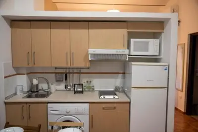 Una cocina o zona de cocina en Philippe's Home Alameda auténtica