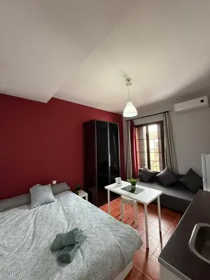Cama o camas de una habitación en Estudio familiar con baño compartido SEVILLA DELUXE LOS ROSALES