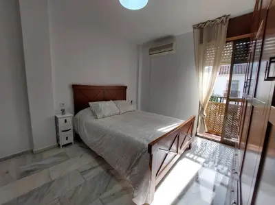 Cama o camas de una habitación en El Patio de Lola