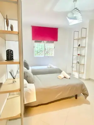 Cama o camas de una habitación en La Casa de Enfrente