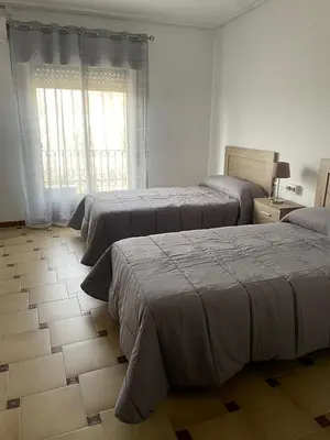 Cama o camas de una habitación en APARTAMENTOS LEONOR