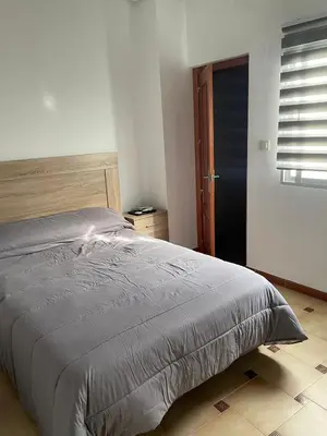 Cama o camas de una habitación en APARTAMENTOS LEONOR