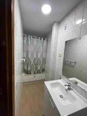 Un baño de APARTAMENTOS LEONOR