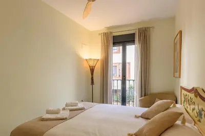 Cama o camas de una habitación en Lovely apartment in Sevilla