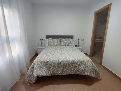 Cama o camas de una habitación en Apartamento en Sevilla con piscina