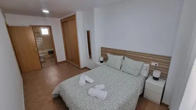 Cama o camas de una habitación en Moderno Apartamento 3 dormitorios y piscina