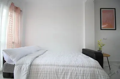 Cama o camas de una habitación en Luminoso estudio Gran Plaza