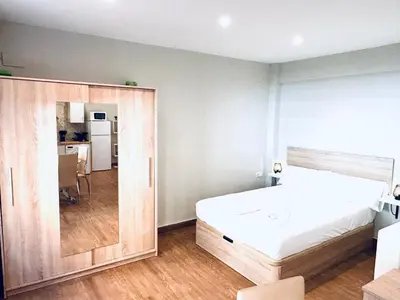 Cama o camas de una habitación en Plaza de Andalucía Home con parking