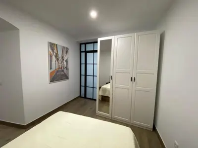 Cama o camas de una habitación en SUITES DEL MAR y SUITE DE CÓRDOBA - Apartmentos en pleno centro