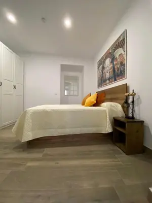 Cama o camas de una habitación en SUITES DEL MAR y SUITE DE CÓRDOBA - Apartmentos en pleno centro