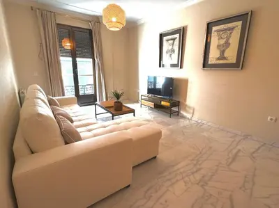 Una televisión o centro de entretenimiento en Apartamento en PLENO CENTRO con APARCAMIENTO opcional