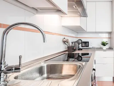 Una cocina o zona de cocina en Apt buenas calidades La Algaba Bazan