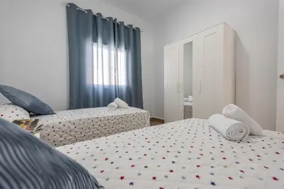 Cama o camas de una habitación en Casa Rural Lola - Lantejuela