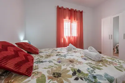 Cama o camas de una habitación en Casa Rural Lola - Lantejuela