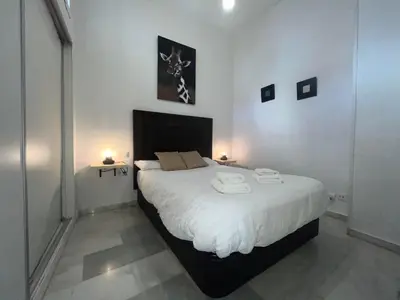 Cama o camas de una habitación en RgHOST-Apartamento La Palma en Casco Histórico