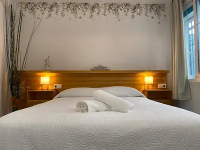 Cama o camas de una habitación en Enmitatiko Alcázar Viejo