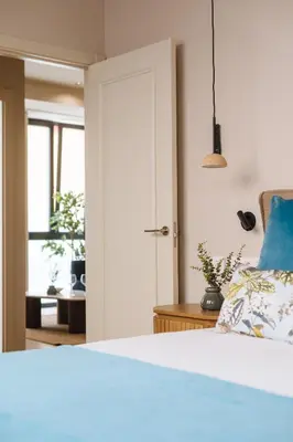Cama o camas de una habitación en New Hostly Alameda Apartments
