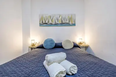 Cama o camas de una habitación en Apartamentos Suite Sol