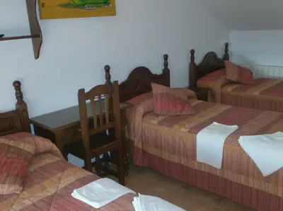 Cama o camas de una habitación en Alojamiento Los Poetas