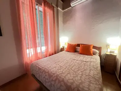 Cama o camas de una habitación en Somos Sevilla Private Apartments