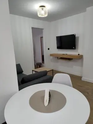Una televisión o centro de entretenimiento en Apartamento Maestra