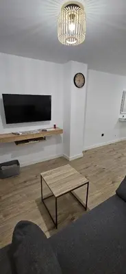Una televisión o centro de entretenimiento en Apartamento Maestra