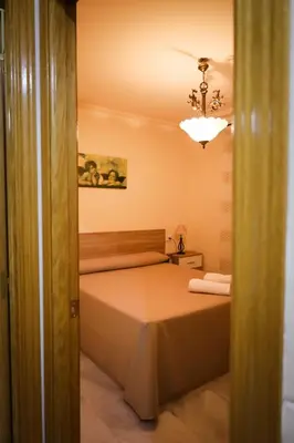 Cama o camas de una habitación en Hospedium DLJ Arjona Centro I