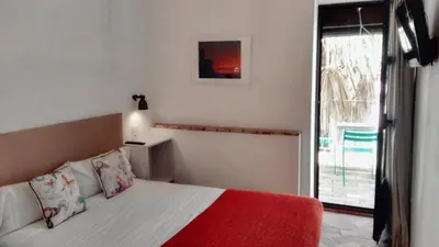 Cama o camas de una habitación en FRENTEABASTOS Boutique