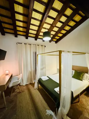 Cama o camas de una habitación en FRENTEABASTOS Boutique