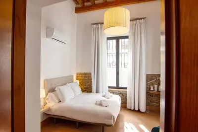 Cama o camas de una habitación en RentalSevilla Lumbreras I